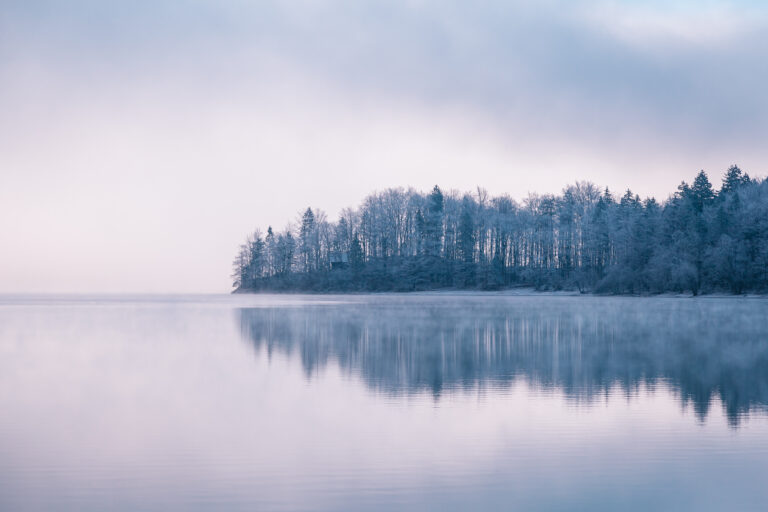 Panoramic morning mist over Lake Bohinj, Slovenia. Concept Winter Landscape.